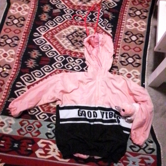 A bundle with a jacket and a stuffed Platypus. - Picture 1 of 3